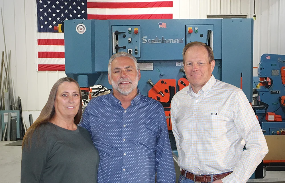 scotchman and steelmax leaders standing in front of industrial machinery